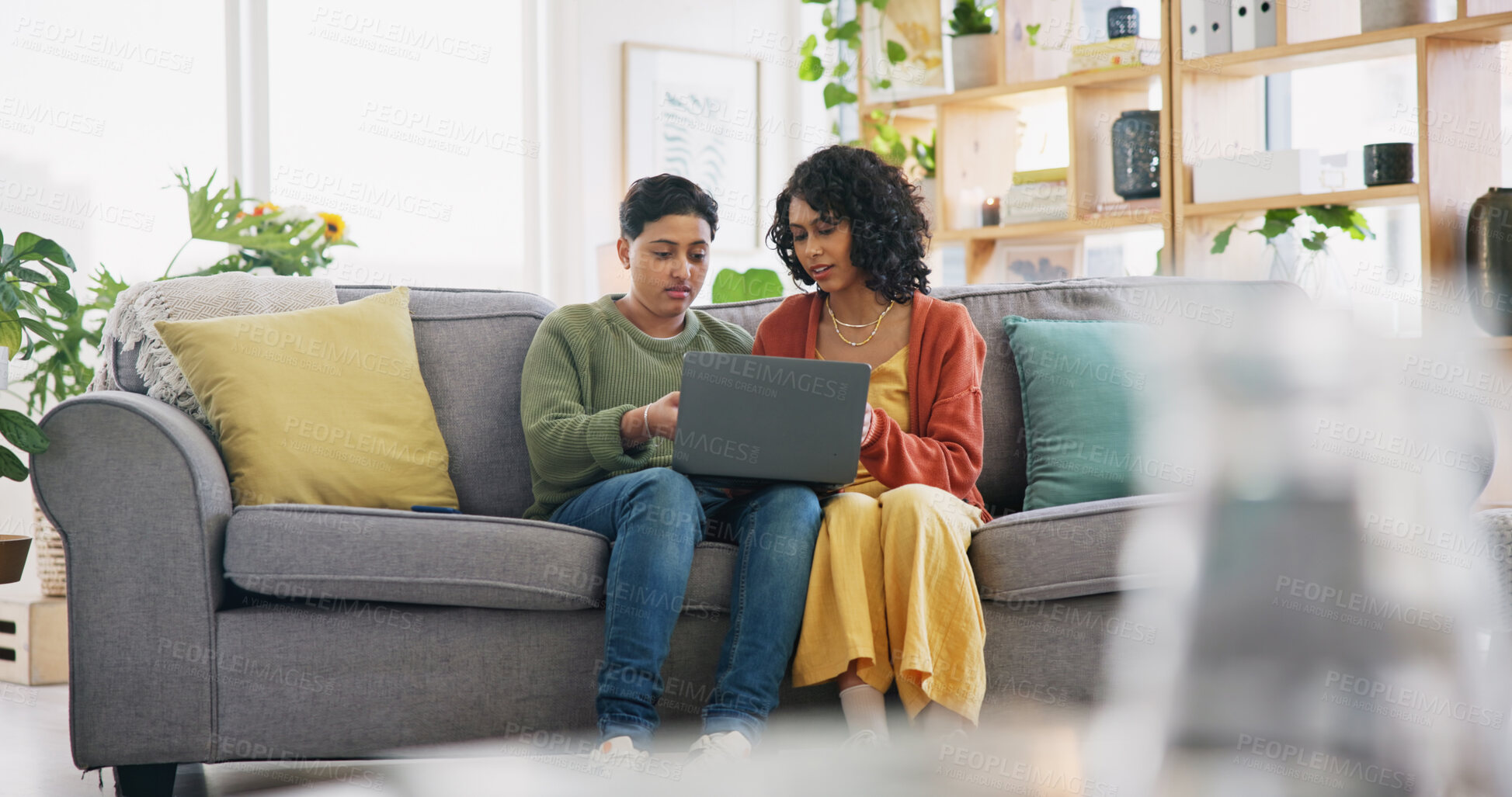 Buy stock photo Lounge sofa, face and gay people speaking, talking and chat about omnichannel. LGBT, laptop and lesbian couple conversation on home online shopping choice, social media post or reading info.