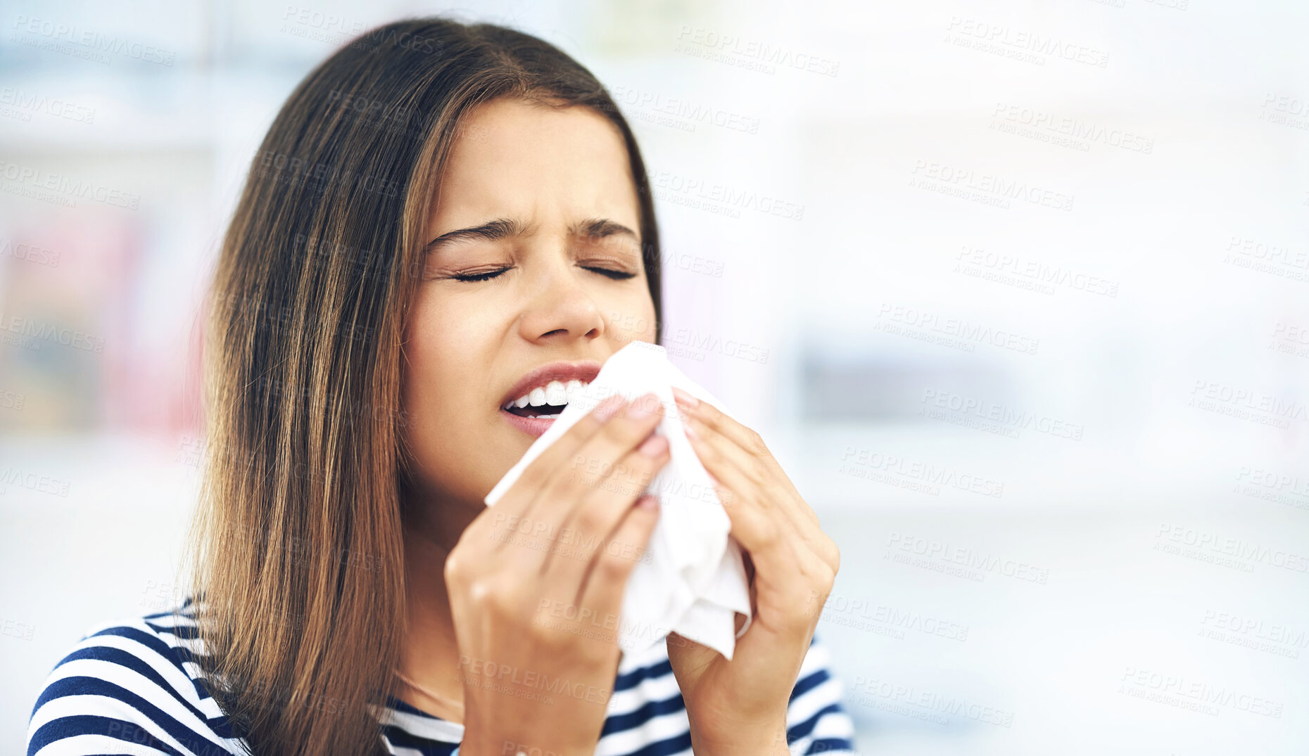 Buy stock photo Sneeze, woman and sick with toilet paper in flu season, allergies or infection in home. Female student, anticipation or nose cloth for virus in living room, FLIRT COVID with mucus congestion or fever