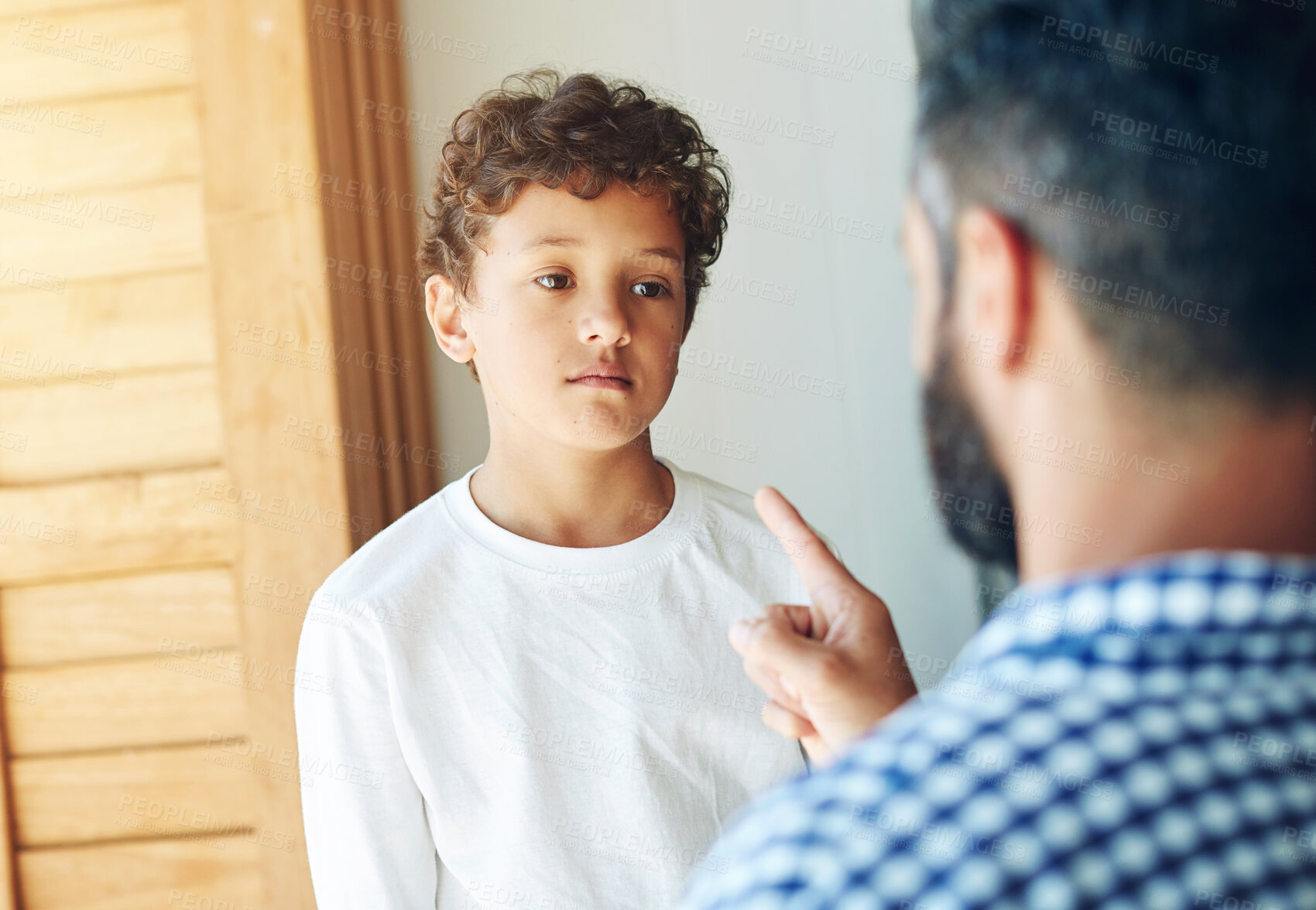 Buy stock photo Sorry, dad and discipline child in home with learning a lesson from mistake or strict parents. Kid, thinking and father teaching son to behave or frustrated with problem or communication of conflict