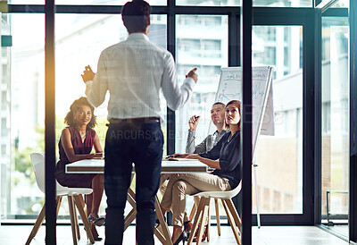 Buy stock photo Businessman, presentation and discussion for finance in conference room with auditing team for company growth and annual sales. Speaker, back and employee in meeting for project strategy in boardroom