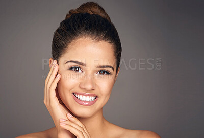 Buy stock photo Face, skincare and woman in studio with self care, happiness and healthy glow on skin. Clean, beauty and girl with natural cosmetics from dermatology for hygiene, wellness or smile in grey background