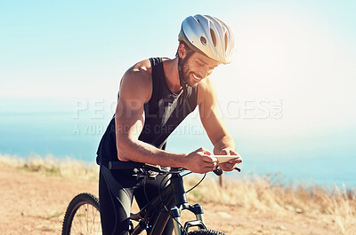 Buy stock photo Man, outdoor and smartphone with bicycle for fitness or workout, health and wellness with communication. Person, online and bike for training on mountain for cycling tour, adventure and trail riding.