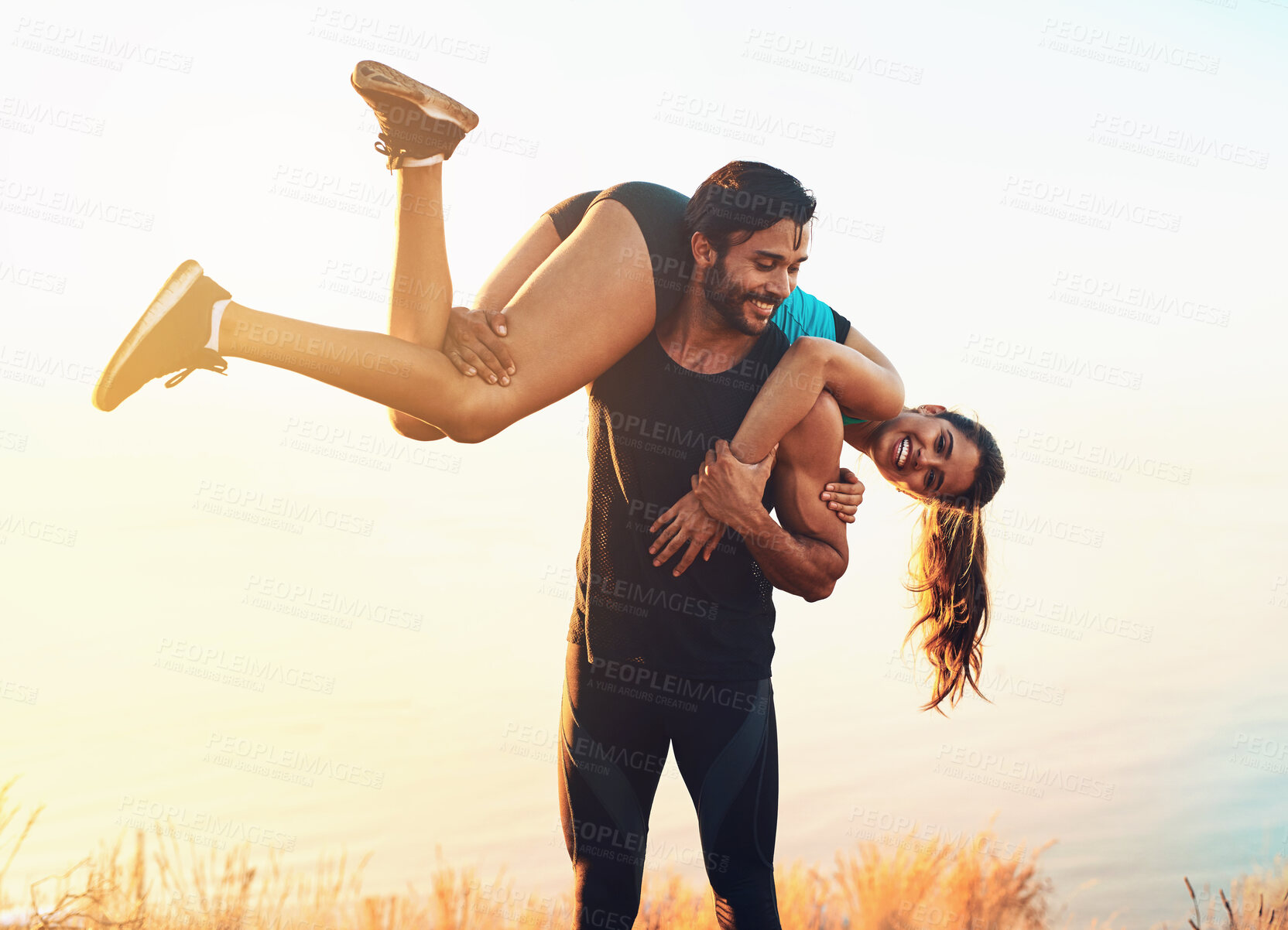 Buy stock photo Nature, couple and carrying with love outdoor for romance, bonding and enjoying together in Spain. Vacation, holiday and adventure with happy people, man and woman while playful in relationship