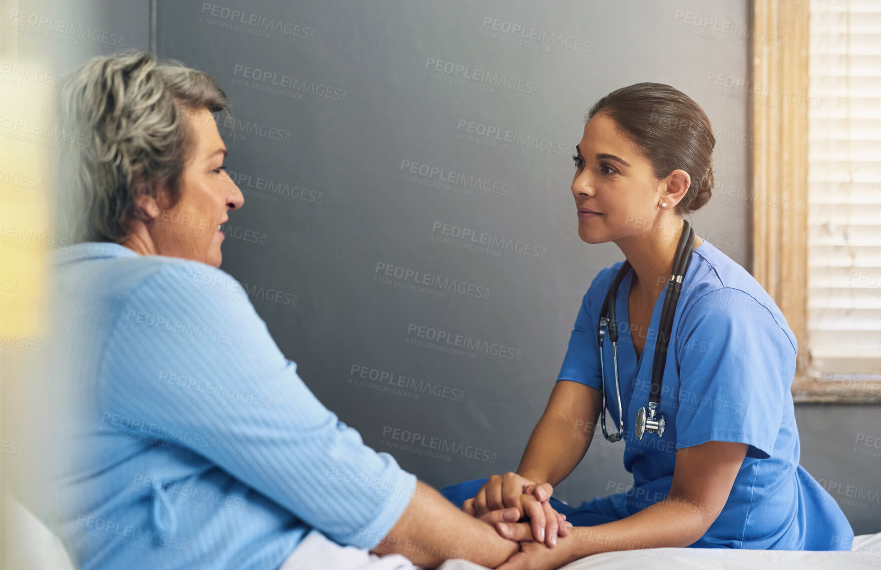 Buy stock photo Holding hands, nurse and senior woman in bedroom with advice for healthcare, consulting or compassion. Support, caregiver and elderly patient for hope, trust or medical conversation at nursing home