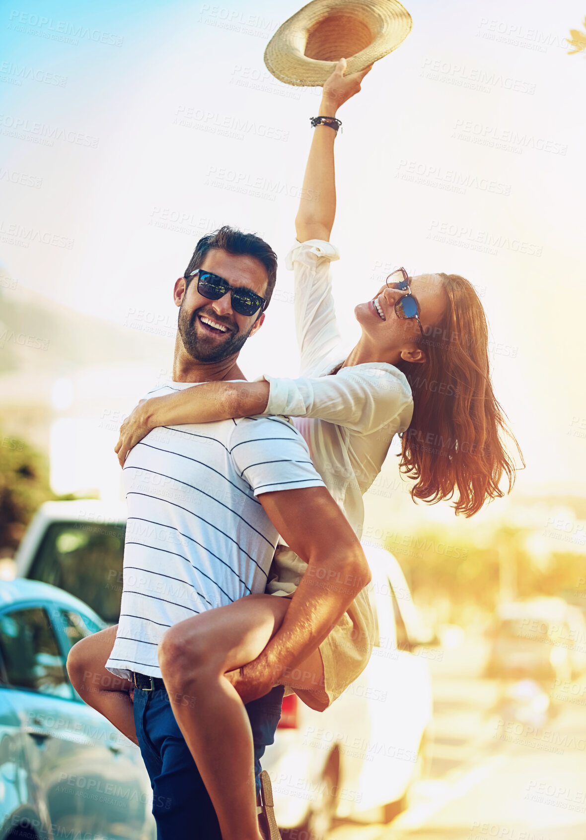 Buy stock photo Couple, people and happy on piggyback in outdoor with lens flare for summer holiday and fun in Brazil. Relationship, love and smile with support or on vacation, trip and travel together as soulmate