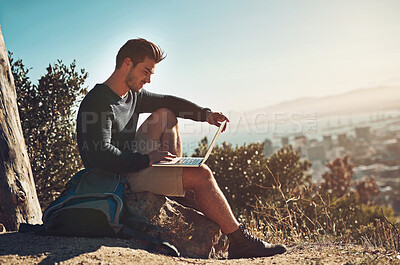 Buy stock photo Happy, man and hiker with laptop outdoor for remote work, connection and map location with scenic view. Male person, freedom and computer in nature for typing, research and adventure blog or website