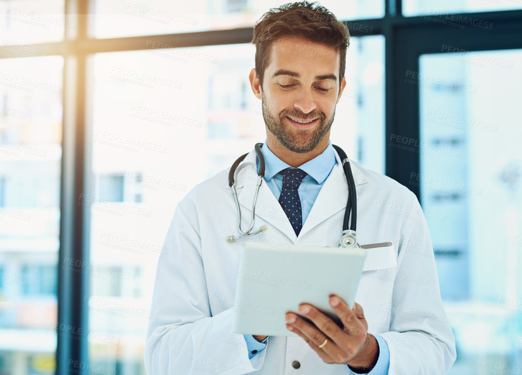 Buy stock photo Hospital, telehealth and man doctor with tablet for patient diagnosis, review charts or consultation. Online, wellness and physician with tech for healthcare, medical analysis or schedule surgery