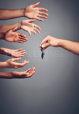 Buy stock photo Hands, studio or reaching for key or opportunity, present or valuable prize for giveaway, Palms and fingers or group of people stretching on gray background, winning gift for competition in Chicago