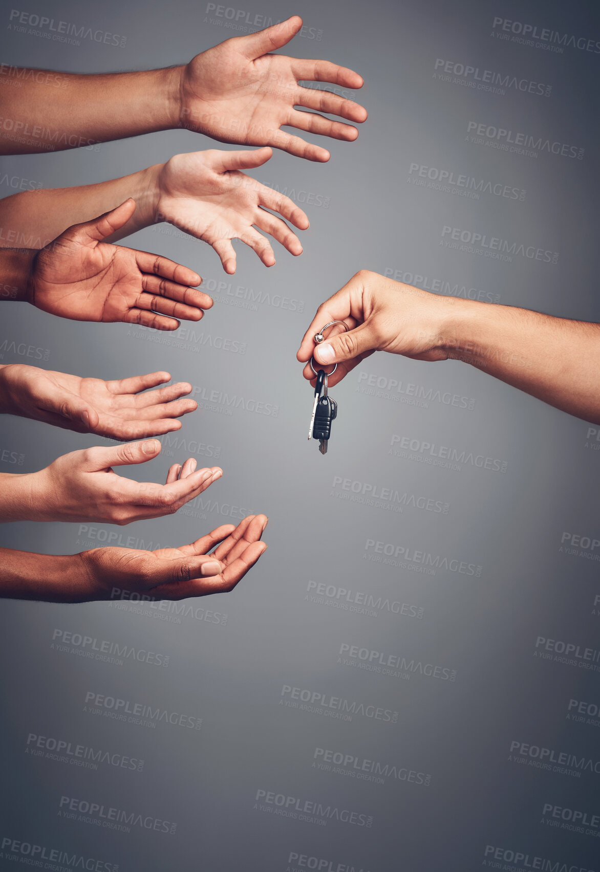 Buy stock photo Hands, studio or reaching for key or opportunity, present or valuable prize for giveaway, Palms and fingers or group of people stretching on gray background, winning gift for competition in Chicago