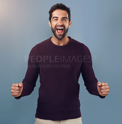 Buy stock photo Portrait, fist and man in studio with celebration for achievement, target or reaching goal with blue background. Lens flare, scream and male person for success, victory or lotto winner on mockup