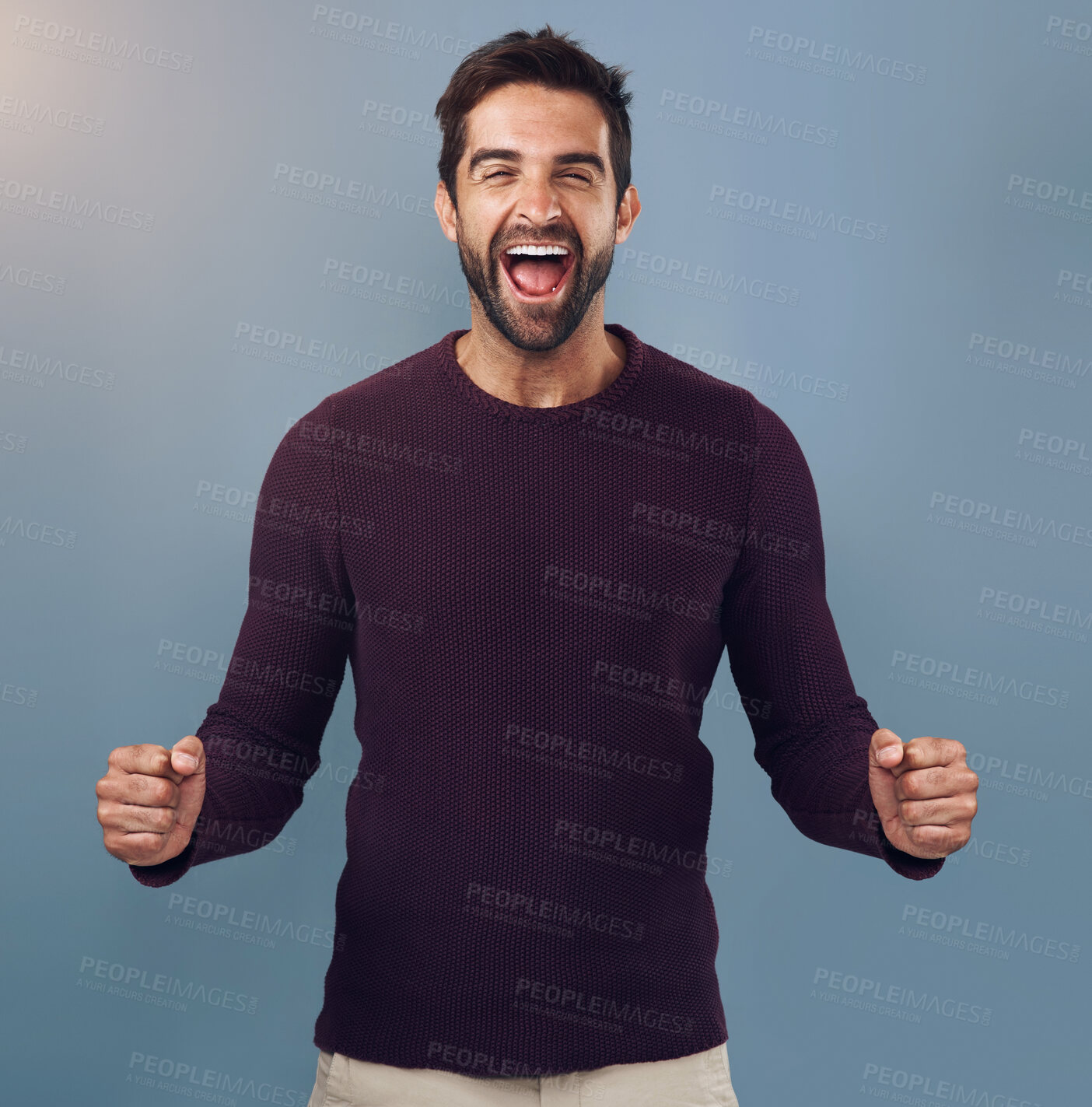 Buy stock photo Portrait, fist and man in studio with celebration for achievement, target or reaching goal with blue background. Lens flare, scream and male person for success, victory or lotto winner on mockup