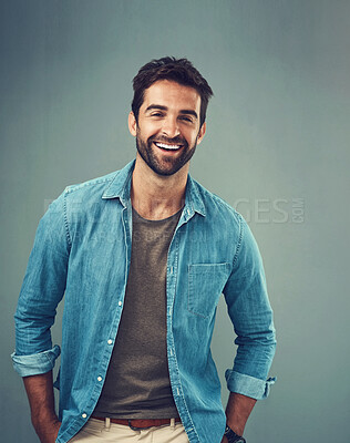 Buy stock photo Portrait, happy and man in studio for smile, fashion and casual person on gray background. Denim, minimalism or male person or model, confidence and casual outfit in Canada and ecofriendly clothing