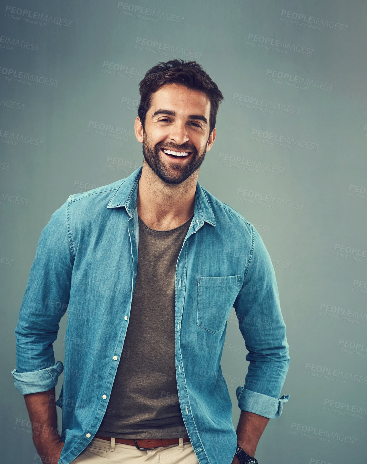 Buy stock photo Portrait, happy and man in studio for smile, fashion and casual person on gray background. Denim, minimalism or male person or model, confidence and casual outfit in Canada and ecofriendly clothing