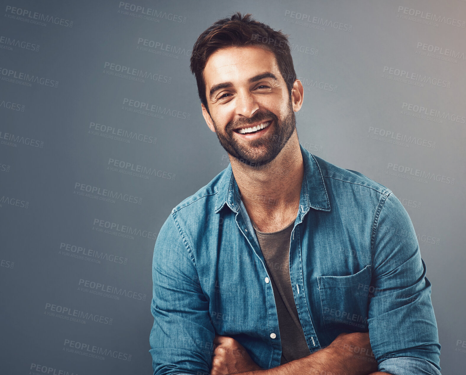 Buy stock photo Portrait, arms crossed and man in studio for smile, fashion and casual person on gray background. Denim, happy or male person or model, confidence and casual outfit in Canada and ecofriendly clothing