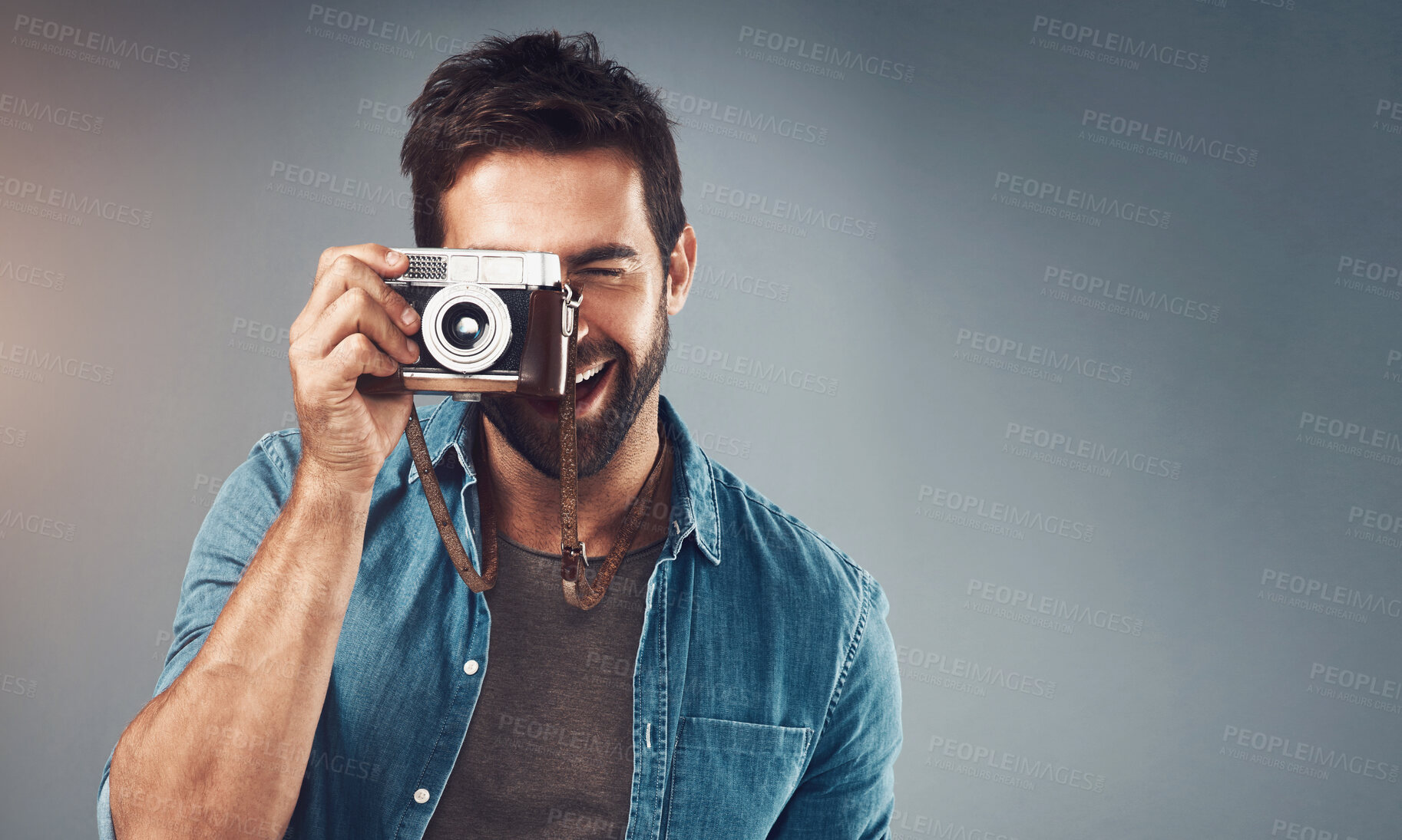 Buy stock photo Vintage, camera and man as photographer in studio for photoshoot, creativity and memory. Mockup, male journalist and film equipment for photography, production and lens focus by gray background