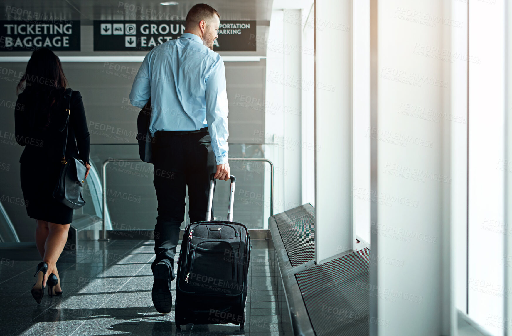 Buy stock photo Travel, suitcase or luggage with business man in airport walking to gate for international trip or adventure. Corporate journey, male person or entrepreneur departure for global opportunity back view