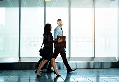 Buy stock photo Walking, airport and business people with luggage, conversation and travel with adventure. Professional, corporate and employees with teamwork, legal aid and attorney with discussion, idea or talking