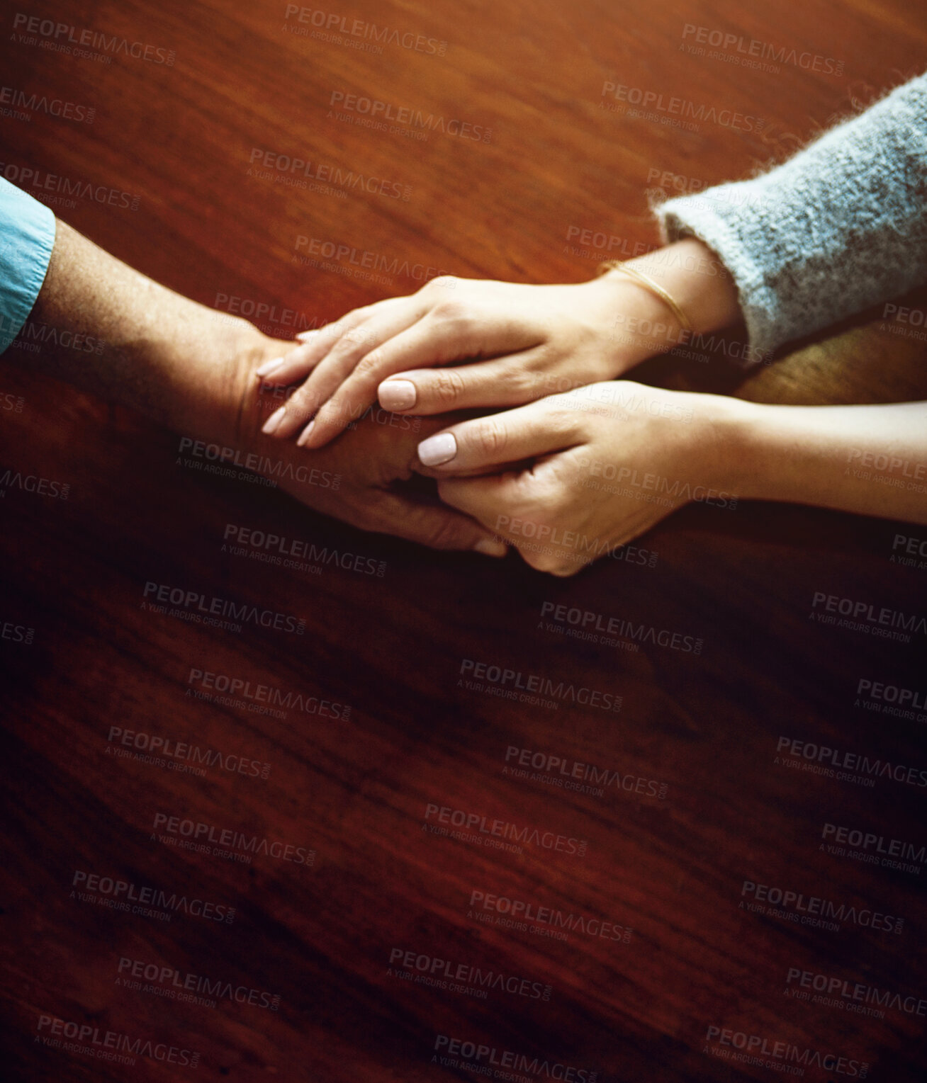 Buy stock photo Support, care and trust with hands of people at wooden table together for hope, empathy and love. Anxiety, depression and pain with couple praying in solidarity for help, from above and mental health