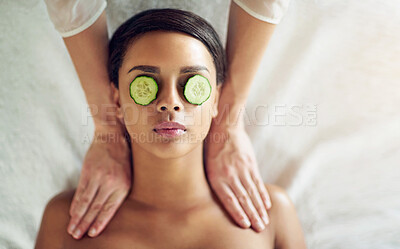 Buy stock photo Woman, massage and cucumber for relax and treatment, hands and salon or spa for selfcare. Pamper, grooming or eye mask for hydration and organic, stress relief or skincare or wellness for calm person