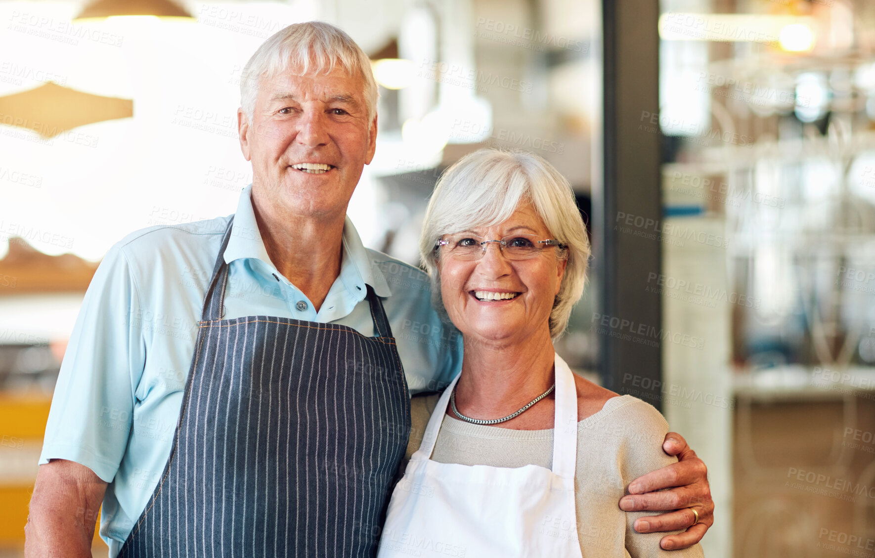 Buy stock photo Senior, couple and smile in cafe business with hug, embrace and ready for hospitality service. People, portrait and coffee shop owner or support in bakery with confidence, happy and store manager