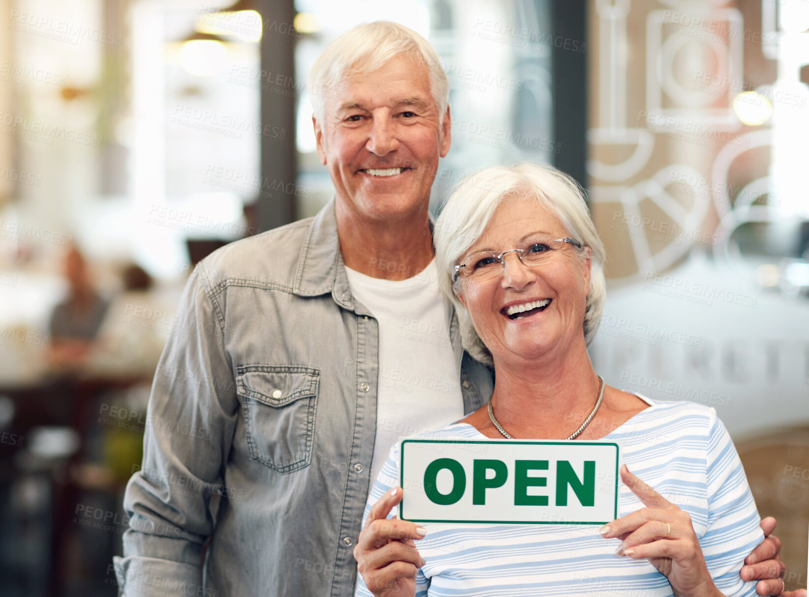 Buy stock photo Senior couple, business and open sign portrait with happy smile from hospitality and coffee shop opening. Working, service and proud elderly people with entrepreneur and cafe owner at restaurant