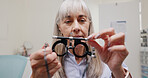 Mature woman, optometrist and frame for eye lens or equipment for examination and vision testing. Closeup, tools and trial for diagnosis or eyesight with assessment, consultation and assistance.