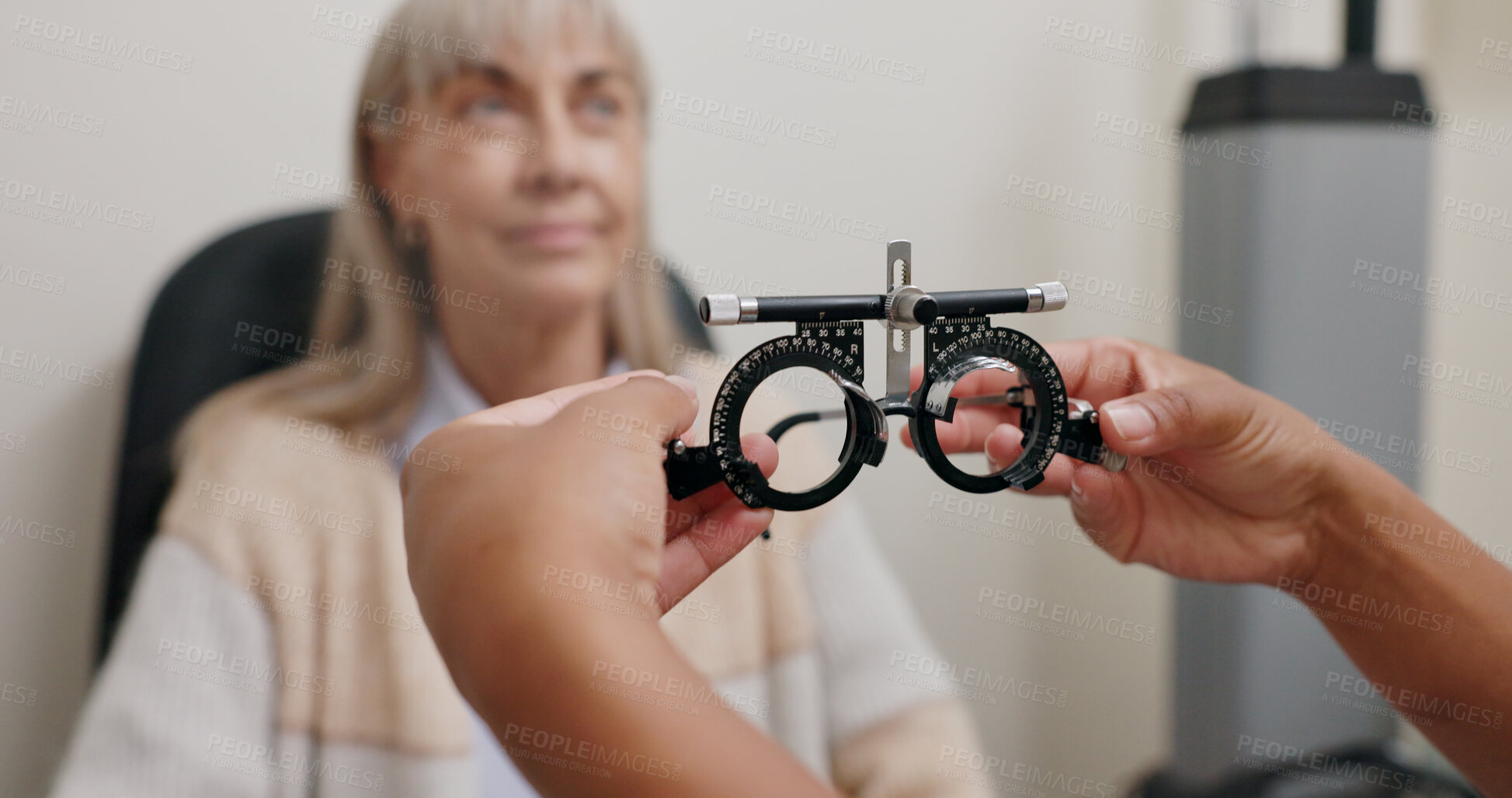 Buy stock photo Optometry, trial lens and senior woman for eye exam, health and wellness in optical store. Ophthalmology, vision and hands of optician with elderly female patient with prescription testing in shop.