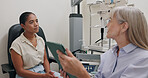 Doctor, office and woman with tablet in consultation with patient at optometrist for eye exam on insurance. Optometry, technology and patient trust results or advice from specialist in healthcare