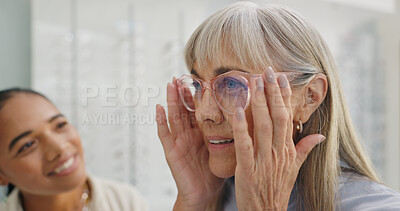 Happy woman, glasses and optician in store for choice, decision or customer service. Eye care doctor with mature client to check lens, vision and new frame for optic health, help or shop consultation