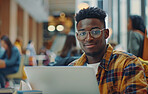 University, portrait and black man with books for studying in library with exam, test or assignment. Smile, computer and male college student with scholarship for education and knowledge on campus.