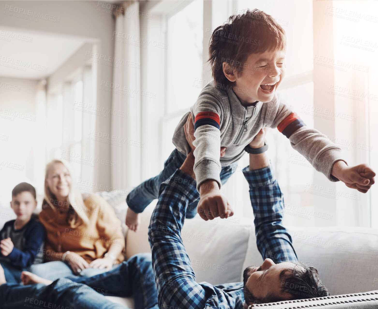 Buy stock photo Love, airplane or father and son on sofa with fun games, laughing or bonding in their home together. Happy family, support and excited boy kid with dad in a living room for flying, fantasy or balance