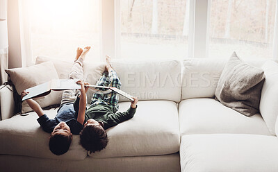 Buy stock photo Upside down, reading books and boys on couch, hobby and activity with fantasy, storytelling and relax. Home, brothers and kids with animation, cute and bonding together with creativity and children