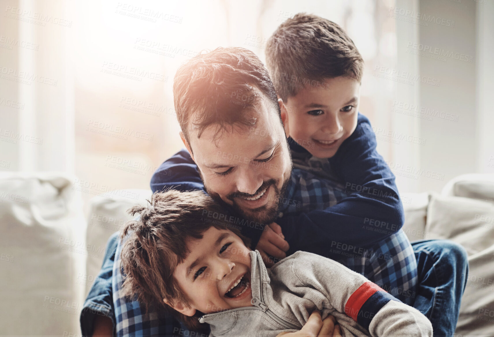 Buy stock photo Funny, home and father with boys, family and laughing in living room for fun, happiness and bonding together. Single parent or kids with joke, care and trust with comedy, relax and cheerful in lounge