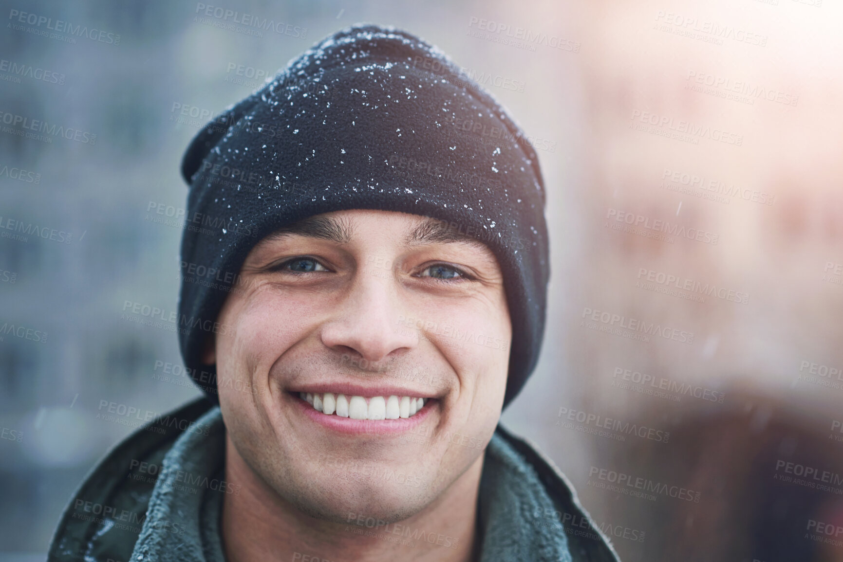 Buy stock photo Man, portrait smile and beanie with snow for cold weather, wellness and travel for holiday break. Male person, hat and happy for winter season with blizzard, ethical fabric and vacation in New York