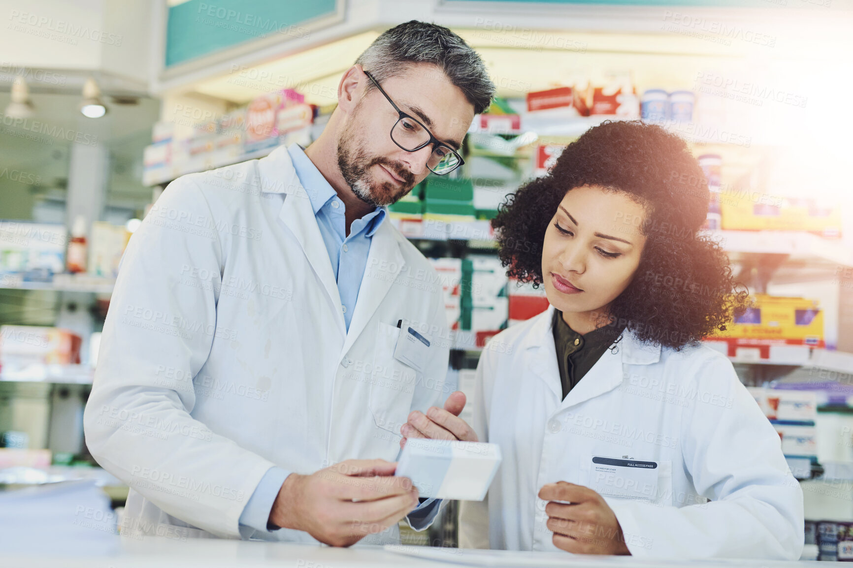 Buy stock photo Man, woman and checking box in pharmacy for prescription drugs, ingredients or medical benefits of pills. Healthcare, pharmacist and consultant reading info on medicine for advice, decision or choice