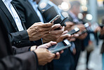 Business people, hands and smartphone outdoor in suit for connection, communication and networking. Mobile tech, workers or employees together in city for teamwork, partnership and collaboration