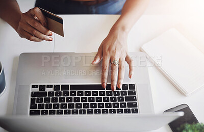 Buy stock photo High angle shot of an unrecognizable female designer shopping online in her home office