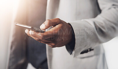 Buy stock photo Closeup shot of an unrecognizable businessman using a cellphone