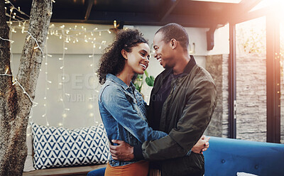 Buy stock photo Happy, couple and love with hug in backyard for marriage, connection and date on anniversary. Man, woman and smile with embrace on patio by fairy lights for support, summer romance and commitment