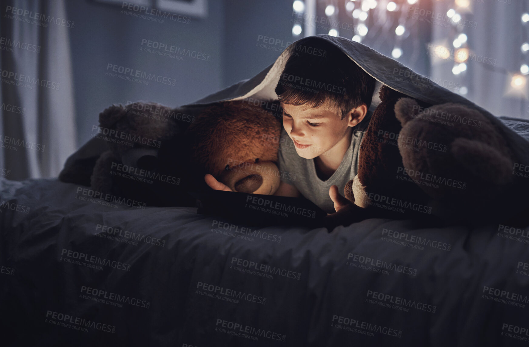 Buy stock photo Boy, child and tablet on bed at night streaming cartoons, online gaming or watching movies with blanket. Kid, teddy bear and digital tech for ebook, video subscription and storytelling app in home