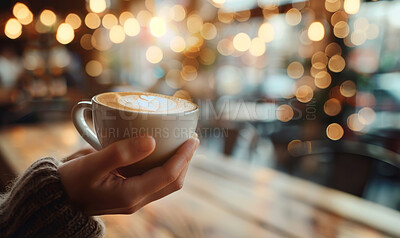 Woman, coffee and closeup with hands for latte art or foam, creative or bokeh with drink. Female person, espresso and milk in restaurant by table for winter, barista with inspiration in New York City