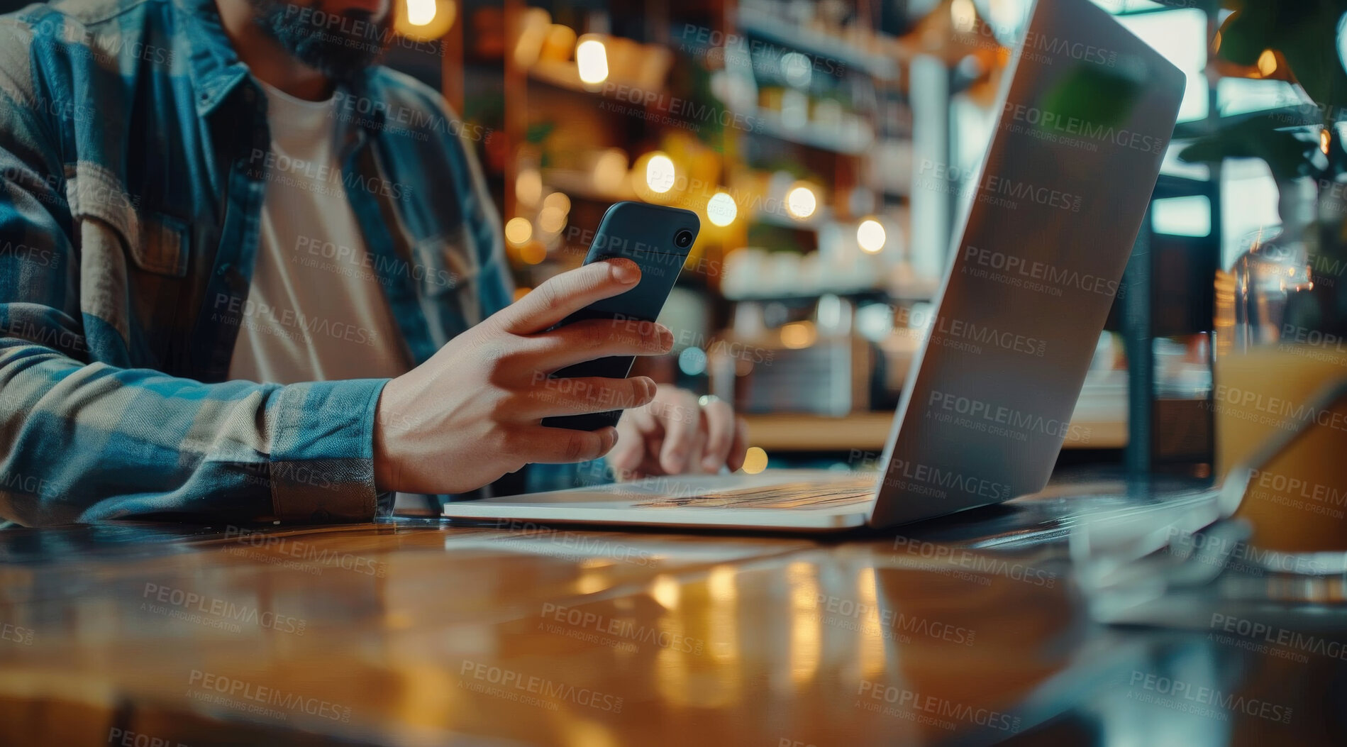 Buy stock photo Person, phone and hands in coffee shop with laptop for remote work online and typing email. Internet, cafe and man in restaurant with freelance article as creative writer with social media research