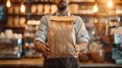 Buy stock photo Coffee shop, paper bag and hands of barista with apron for caffeine, premium espresso blend or roast. Packaging, service and employee with ingredient for hot beverage, latte or aroma in restaurant