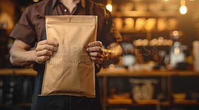 Buy stock photo Coffee shop, packaging and hands of barista with apron for caffeine, premium espresso blend or roast. Paper bag, service and employee with ingredient for hot beverage, latte or mockup in restaurant