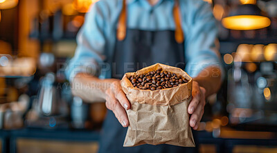 Hands, paper bag and coffee beans with caffeine in cafe for premium espresso blend, roast and breakfast drink. Barista, package and ingredient for latte in restaurant for morning beverage and aroma