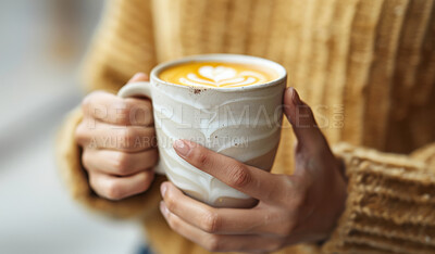 Woman, espresso and closeup with hands for latte art or foam, creative or care with drink. Female person, coffee and zoom with milk in restaurant for winter, barista with inspiration in New York City