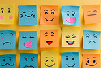 Paper, art or sticky note face drawing on wall for creative, design or storyboard sketch. Classroom, school or autism emotion cards for learning, understanding or autistic student feeling identifier