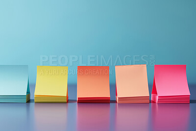Sticky notes, art and creativity with color in studio on blue background for planning, vision and ideas. Writing, collaboration and mockup space for text, project and assignment to brainstorm