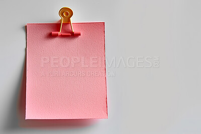 Buy stock photo Sticky note, clip and message with reminder for agenda, tasks or post on a white studio background. Closeup of document or pink page with alert, review or memo of sign for notice on mockup space