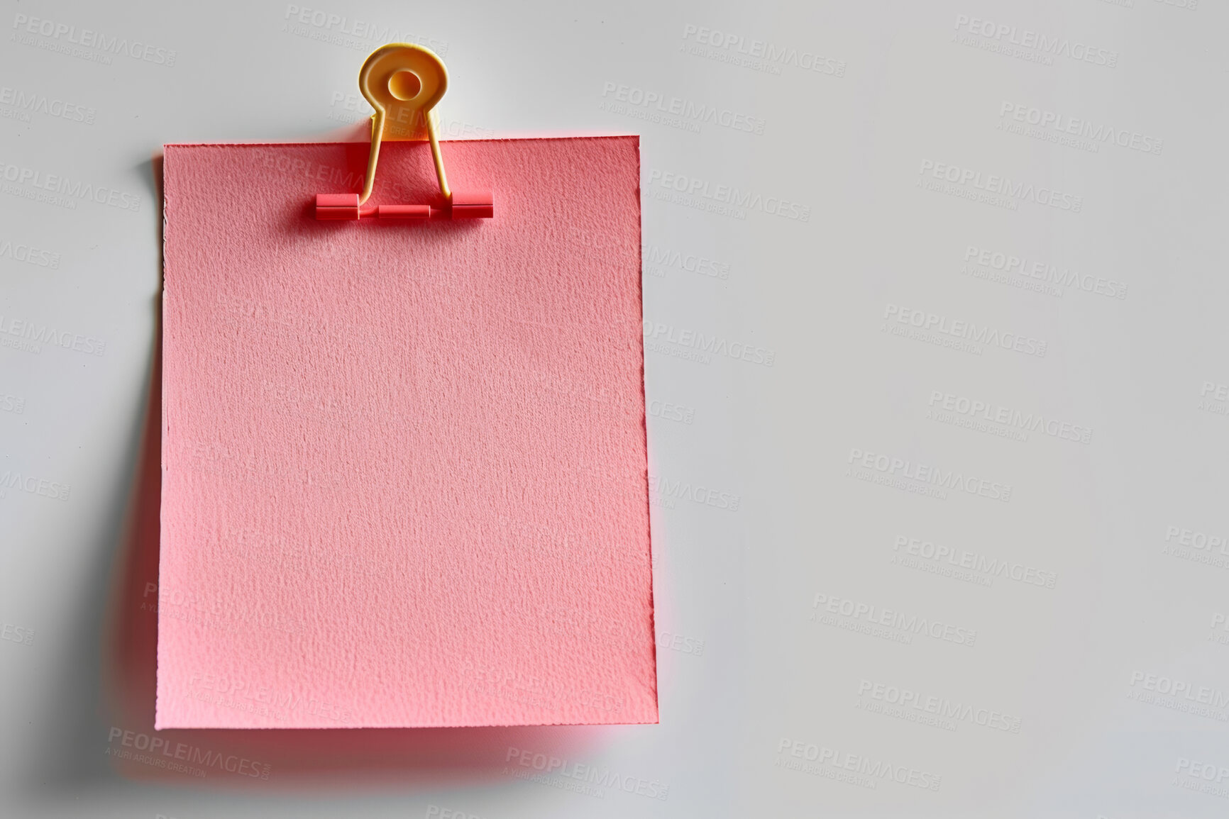 Buy stock photo Sticky note, clip and message with reminder for agenda, tasks or post on a white studio background. Closeup of document or pink page with alert, review or memo of sign for notice on mockup space